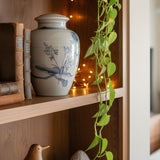 10 Creative Ways to Display an Urn on a Bookshelf (That Still Feels Like Home) - Funeral.com, Inc.