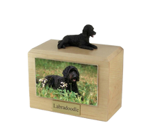 Wooden Pet Urn with Lying Down Black Labradoodle Figurine & 4x6 Inches Photo Holder