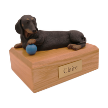 Playful Black Dachshund, Lying Down with Ball Figurine Pet Cremation Urn