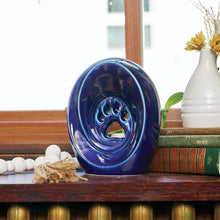 Blue Ceramic Medium Pet Urn with Tranquil Paw Design - Lifestyle