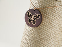 Dark Brown Wood Pendant with Butterfly Design - Artistic
