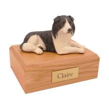 Black and White Border Collie, Lying Down Figurine Pet Cremation Urn - Funeral.com, Inc.