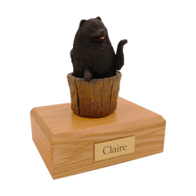 Black Pomeranian, Sitting in Tree Stump Figurine Pet Cremation Urn - Funeral.com, Inc.