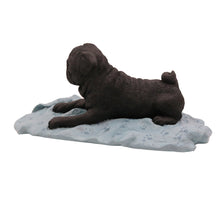 Black Pug, Lying Down on a Blanket Figurine Pet Cremation Urn - Funeral.com, Inc.