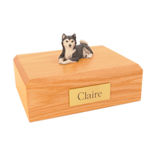 Black & White Husky, Lying Down Figurine Pet Cremation Urn - Funeral.com, Inc.