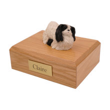 Black & White Pekingese, Lying Down Figurine Pet Cremation Urn - Funeral.com, Inc.