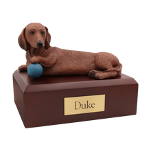 Playful Red Dachshund, Lying Down with Ball Figurine Pet Cremation Urn - Funeral.com, Inc.