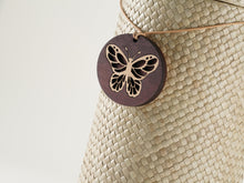 Round Wood Pendant with Butterfly Design - Funeral.com, Inc.
