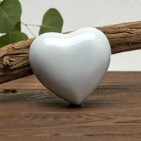 Amorette Pearl White Heart Pet Urn - funeral.com - Tree Background Display