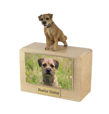 Wooden Pet Urn with Sitting Border Terrier Tongue - Out Figurine & 4x6 Inches Photo Holder - Funeral.com, Inc.