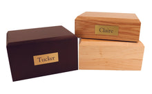 Wooden Traditional Pet Cremation Urn with Paw Print Adornment - Funeral.com, Inc.